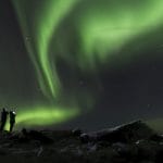 Northern Lights Iceland | Iceland Travel Guide, two people watching the northern lights in Iceland
