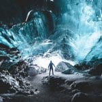 Ice Cave Tours, a man standing inside Katla Ice Cavel the best summer self driving tours in Iceland
