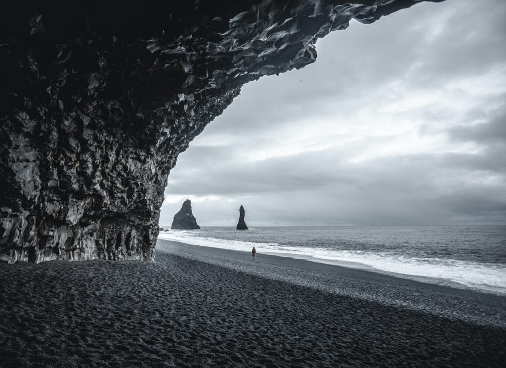 Black Sand Beach Tour, seen from the cave at Reynisfjara black sand beach, Hálsanefshellir cave on Reynisfjara black sand beach