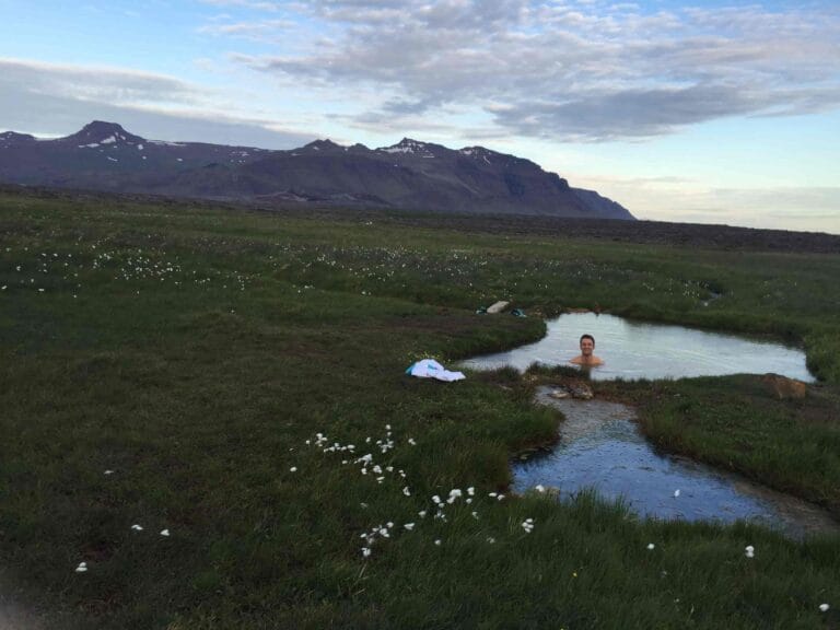 Sturlungalaug hot spring in Snæfellsnes Peninsula, hidden hot spring in Iceland with a view of the mountains
