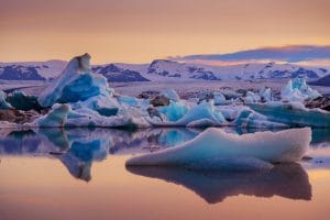 Midnight sun at Jokulsarlon glacier lagoon in south Iceland