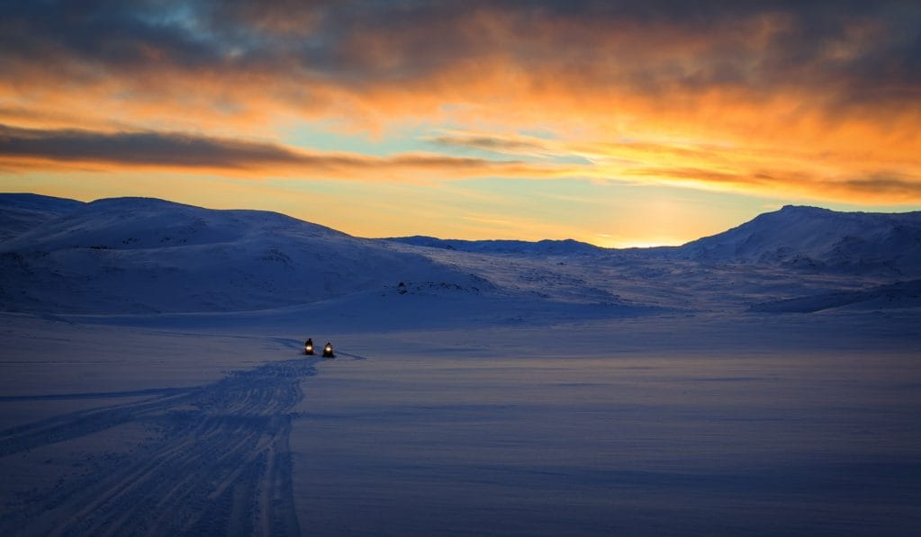 Iceland Snowmobile Tour, Snowmobile Iceland, Snowmobiling in Iceland, sunset over the glacier on a snowmobile trip