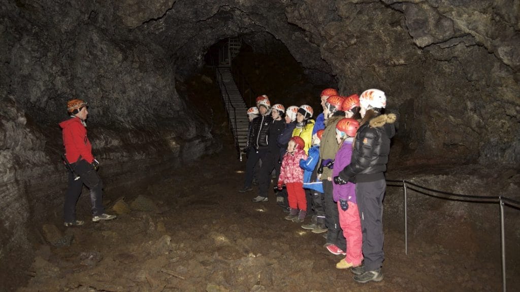 people on a tour in Vatnshellir lava cave in Snæellsnes Peninsula