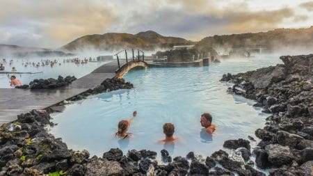 three people relaxing in the Blue Lagoon in Iceland