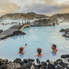 three people relaxing in the Blue Lagoon in Iceland