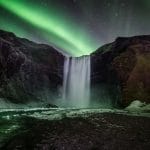 Northern lights at Skógafoss waterfall in Iceland