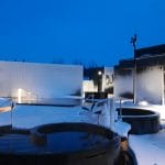 snow covered ground at Krauma geothermal baths and spa in west Iceland