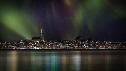 northern lights above Reykjavik and Hallgrimskirkja church