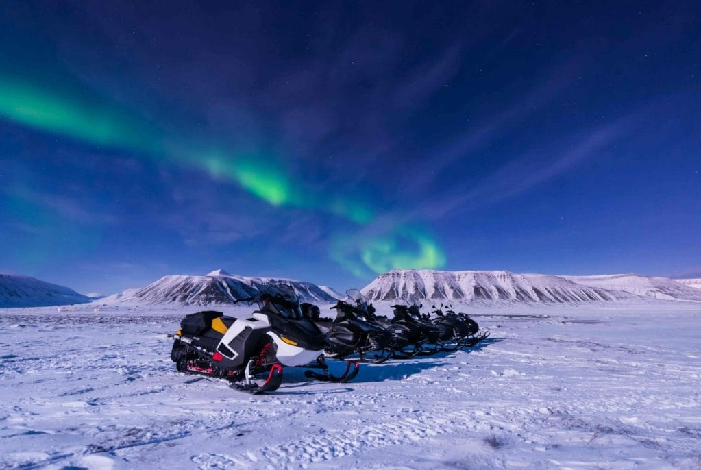 Iceland Snowmobile Tour, Snowmobile Iceland, Snowmobiling in Iceland, northern lights over snowmobiles in Iceland