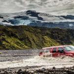 Super Jeep Tours Iceland, Super Jeep driving over a river on the way to Þórsmörk in the highlands of Iceland