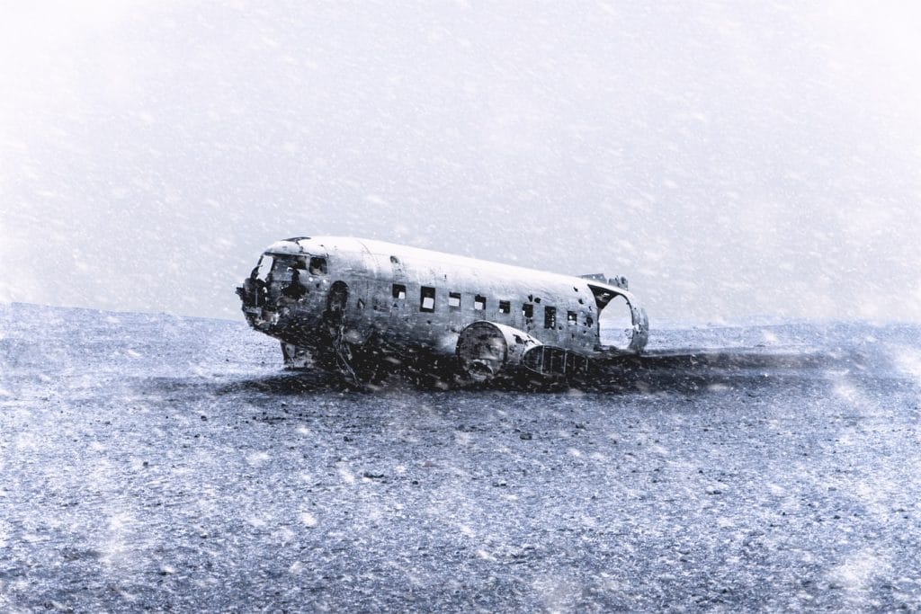 snow falling at Solheimasandur Plane Wreck in south Iceland