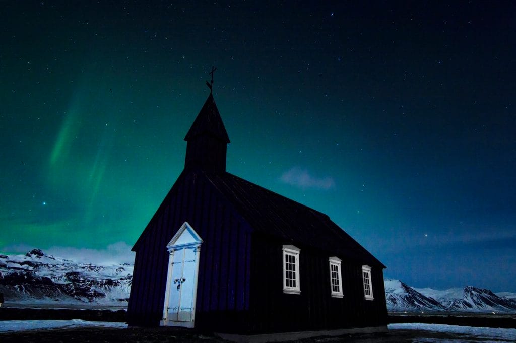 northern lights over Búðarkirkja black church in Búðir Snæfellsnes