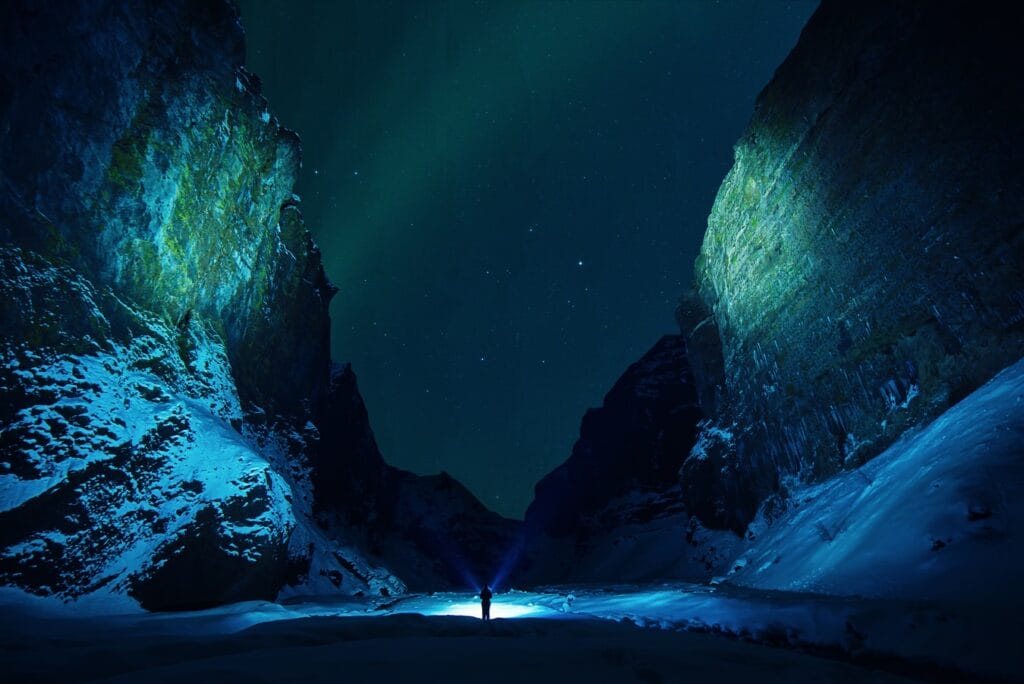 northern lights over Stakkholtsgja canyon during winter, game of thrones location in Iceland