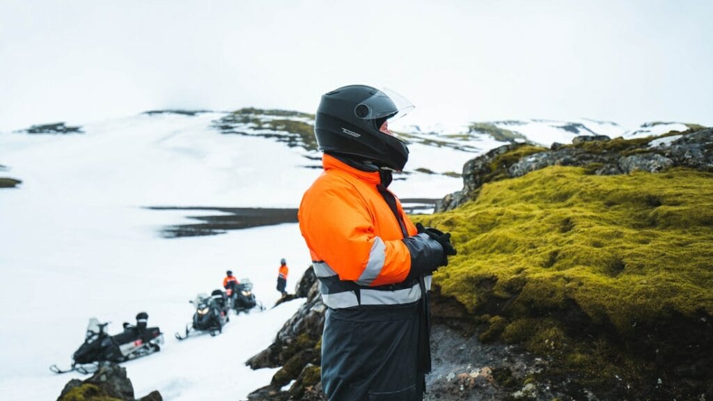 Iceland Snowmobile Tour, Snowmobile Iceland, Snowmobiling in Iceland, people on Eyjafjallajokull snowmobile tour with views of green moss