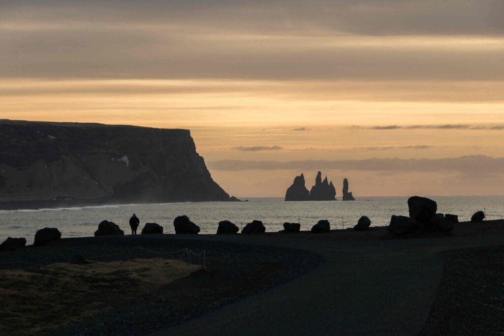 Black Sand Beach Tour, Kirkjufjara black sand beach and Eagle Rock in south Iceland with views over to Reynisfjara and Reynisdrangar