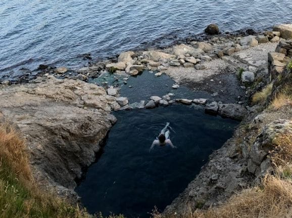 Hellulaug hot spring in the westfjords of Iceland