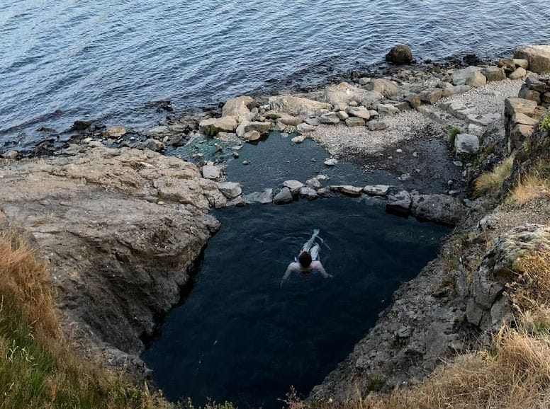 Hellulaug hot spring in the westfjords of Iceland