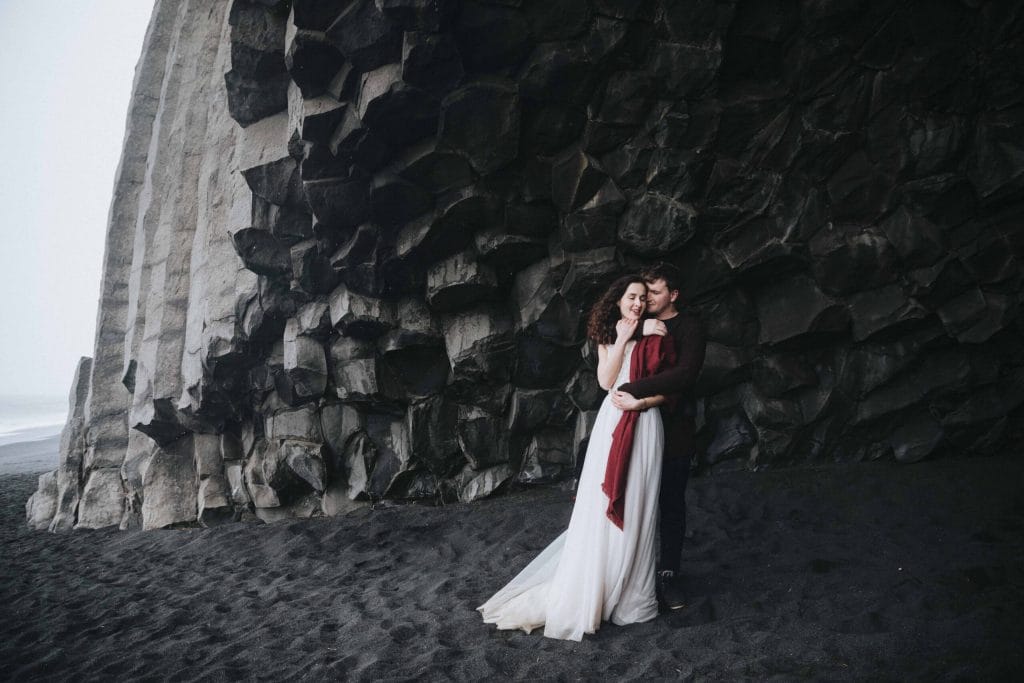 wedding photo shoot at Reynisfjara black sand beach in Iceland, Hálsanefshellir cave on Reynisfjara black sand beach