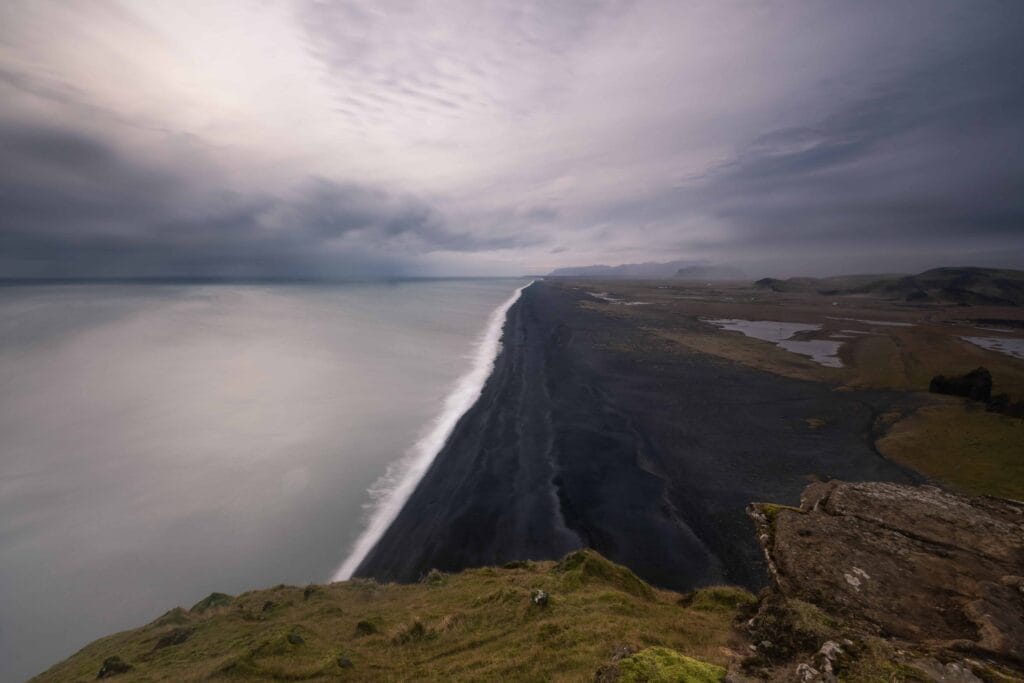 View over the black sand beach seen from Dyrhólaey cliffs in south Iceland