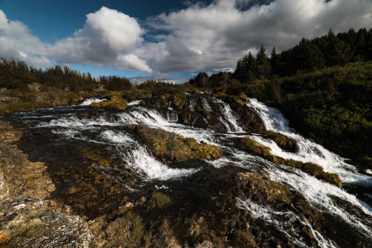 Kermóafoss waterfall in Elliðaárdalur valley in Reykjavik, hidden waterfall in Reykjavik