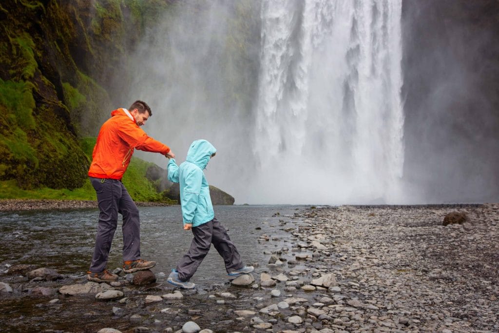 Iceland Family Travel at Skogafoss waterfall in south Iceland