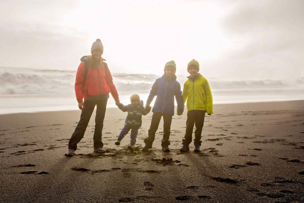 Iceland Family Travel on the black sand beach