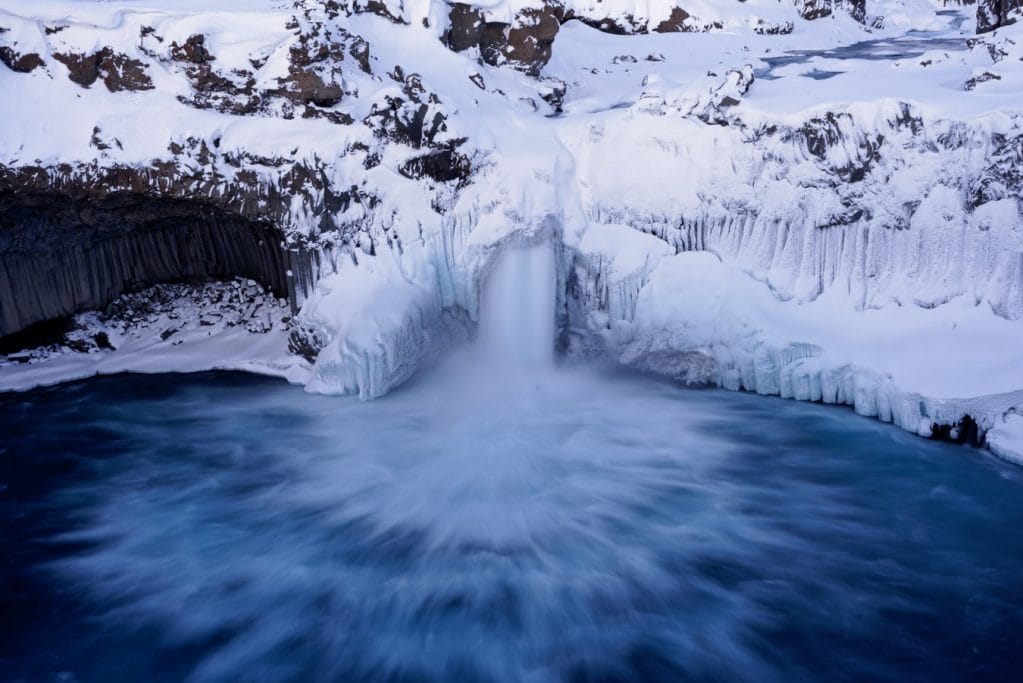 winter and snow at Aldeyjarfoss waterfall in the northern highlands of Iceland