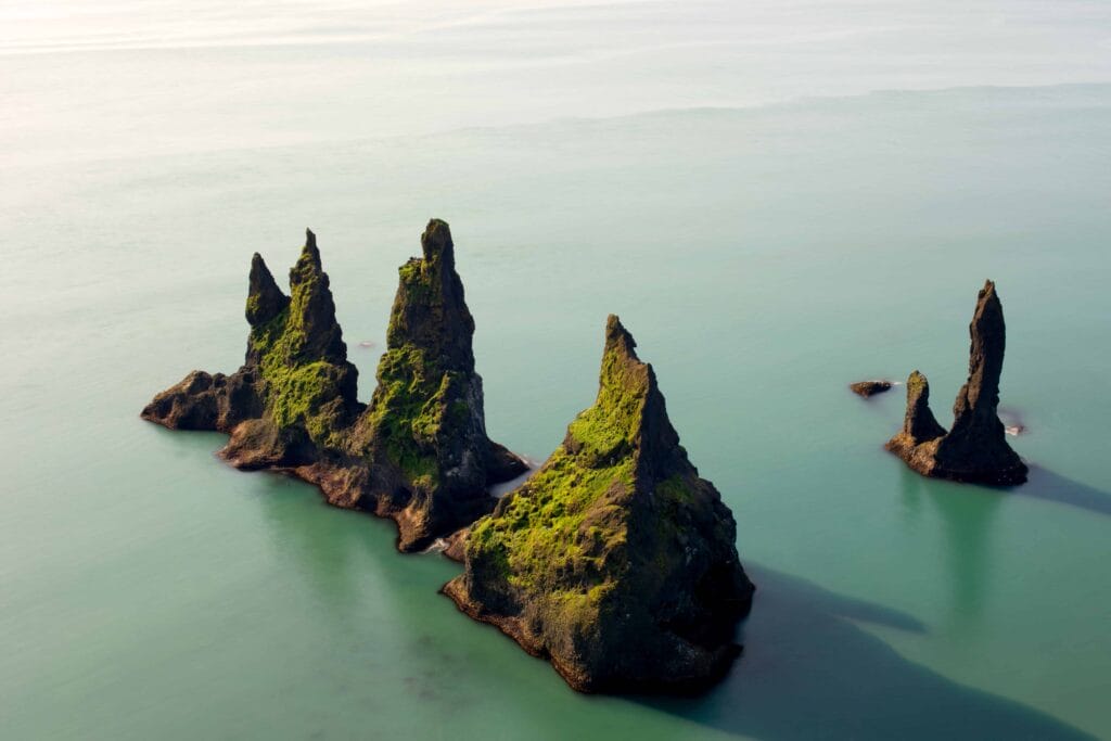 Reynisdrangar cliffs in Reynisfjara black sand beach, Trolls in Iceland