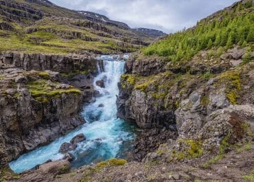 Sveinstekksfoss Waterfall | Immersing in the Miraculous Hidden Waterfall
