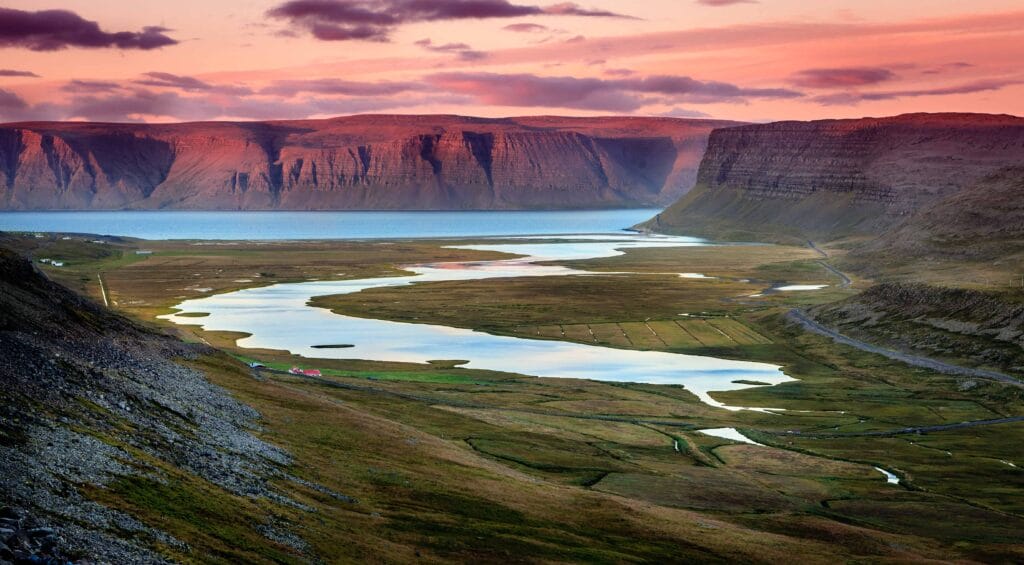 midnight sun and fjords in Westfjords in Iceland