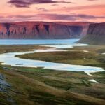 midnight sun and fjords in Westfjords in Iceland
