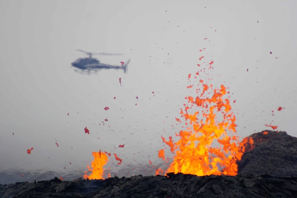 Helicopter Tour Iceland Volcano, Iceland Helicopter volcano, active volcano tour, helicopter flying over Geldingadalur erupting volcano in Iceland