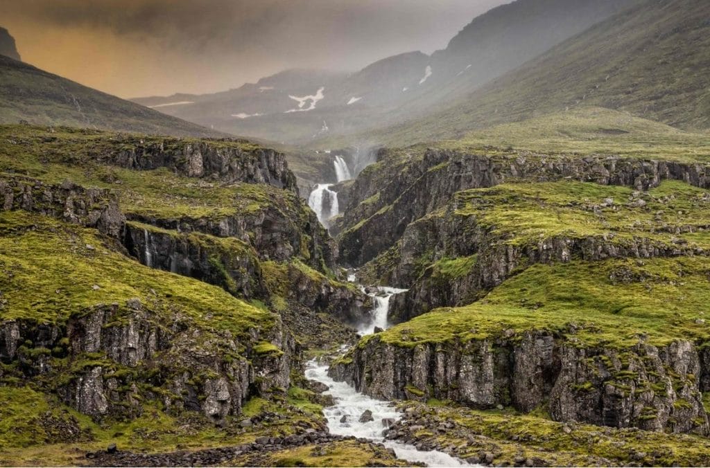 Klifbrekkufossar multi layer waterfalls in Mjoifjordur east Iceland