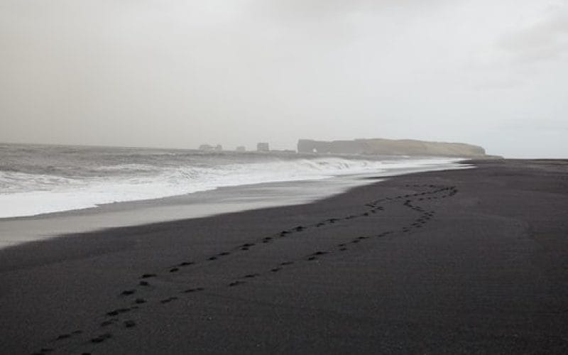 Reynisfjara black sand beach with views over to Dyrhólaey in South Iceland