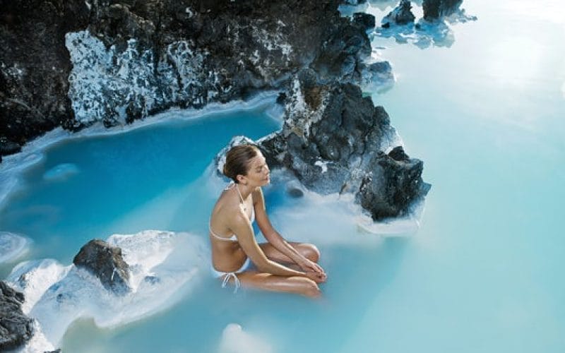woman sitting in the Blue Lagoon in Iceland