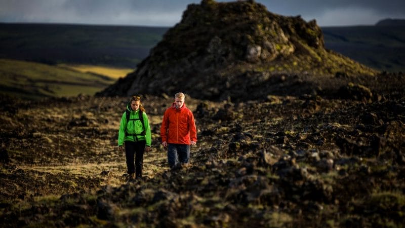 Two people hiking Þrihyrningur mountain in south Iceland