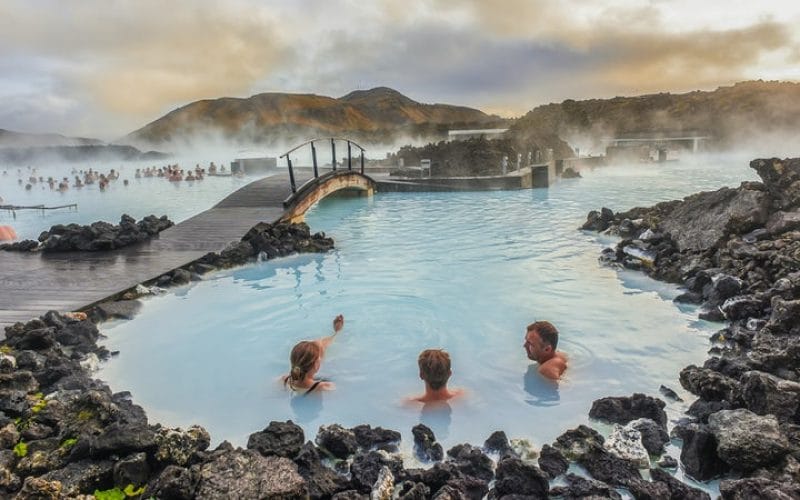 three people relaxing in the Blue Lagoon in Iceland