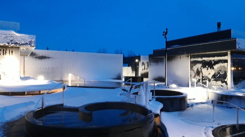 snow covered ground at Krauma geothermal baths and spa in west Iceland