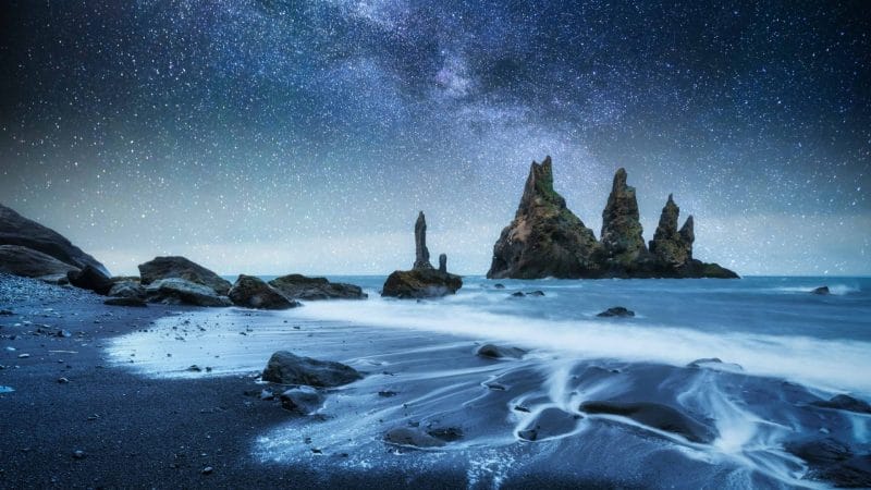 Reynisdrangar cliffs in Reynisfjara black sand beach, Trolls in Iceland