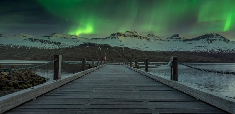 northern lights in Fáskrúðsfjörður village in Eastfjords of Iceland