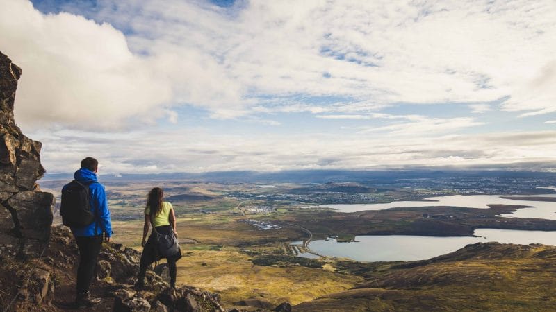 Honeymoon in Iceland, hiking on Esjan mountain with view over Reykjavik