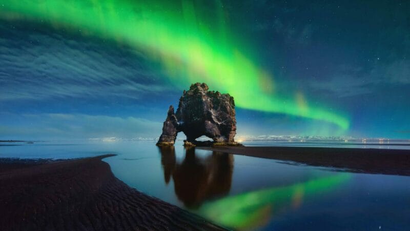 northern lights at Hvítserkur cliff in north Iceland