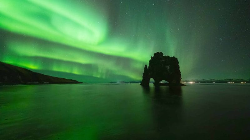 northern lights at Hvítserkur cliff in north Iceland