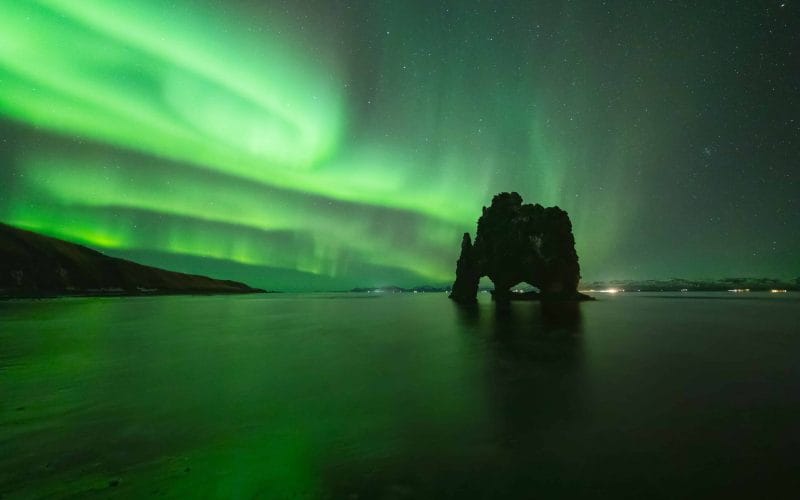 northern lights at Hvítserkur cliff in north Iceland