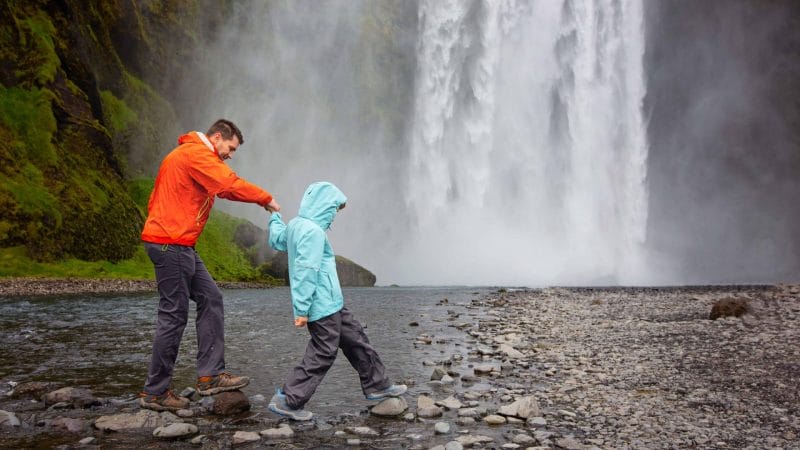Iceland Family Travel at Skogafoss waterfall in south Iceland