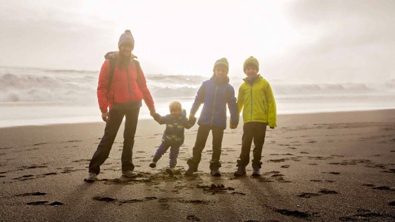 Iceland Family Travel on the black sand beach