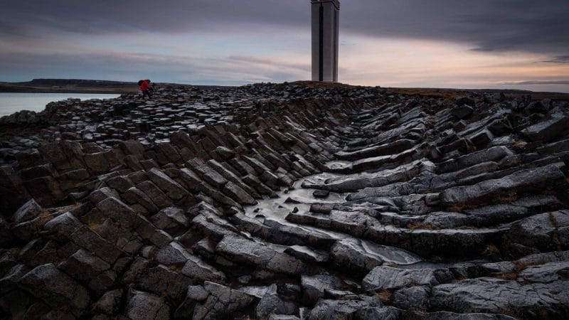 Kálfshamarsvíkurviti lighthouse in north Iceland - Kálfshamarsvíkur cove basalt columns