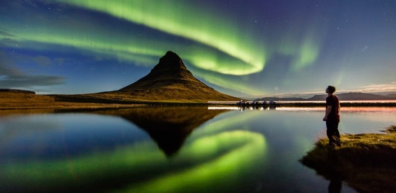 Northern Lights Iceland | Iceland Travel Guide, northern lights aurora borealis dancing over Kirkjufell mountain and Kirkjufellsfoss waterfall in Snæfellsnes Peninsula