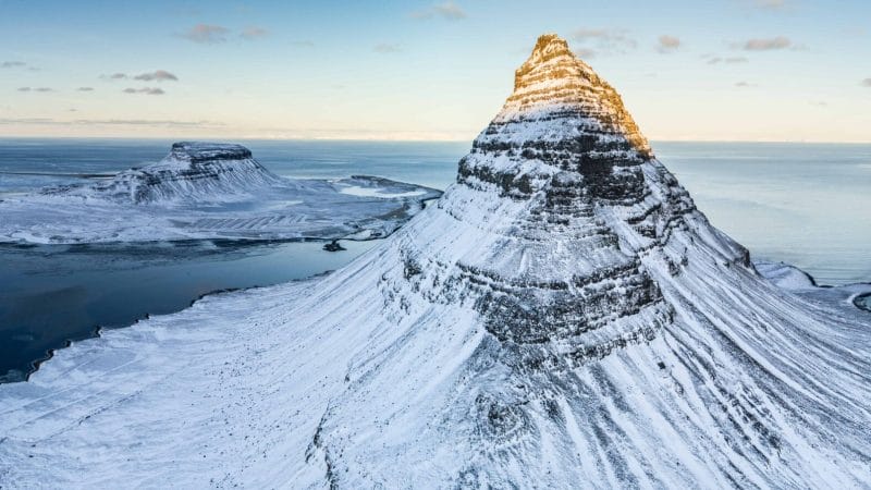 Kirkjufell mountain seen from above with snow during winter