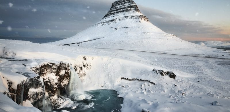 Kirkjufell mountain and Kirkjufell waterfall in Snæfellsnes during winter with snow